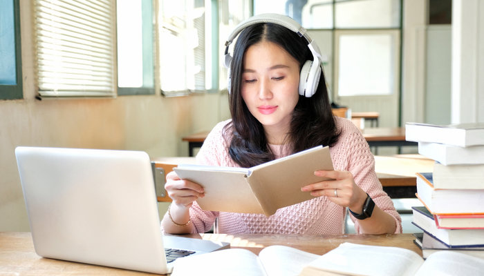 young woman listenining to music - Music As A Comfort